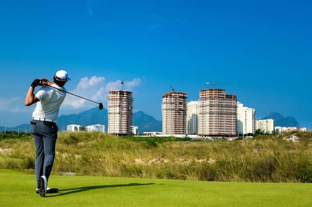 The skyscrapers of Rio provide the backdrop to the new Olympic course, a far cry from its roots at the Castle Stuart course outside Inverness. Picture: Getty