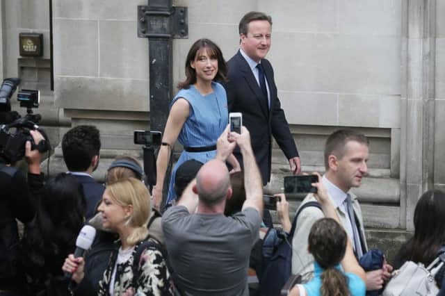 David Cameron and his wife Samantha leave after casting their votes in the EU referendum. Picture: PA