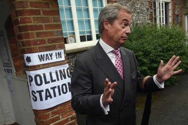 Nigel Farage, leader of UKIP and Vote Leave campaigner, talks to the media outside his local polling station. Picture: Getty