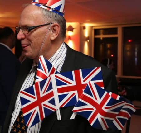 A Leave.EU supporter wears Union flags anda Union flag  hat as the results come in. Picture: Getty
