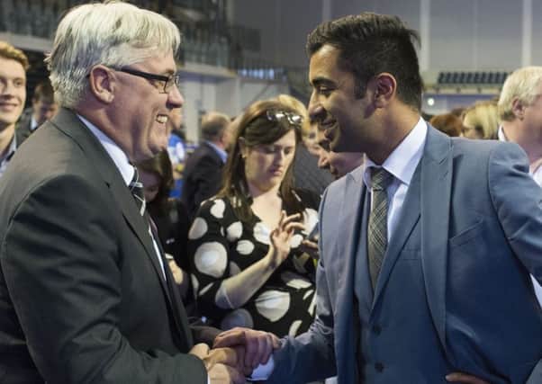 Scottish Government Minister for Transport and the Islands Humza Yousaf (right) shakes hands with the leader of Glasgow City Council, Frank McAveety after hearing the results in Glasgow. Picture: PA