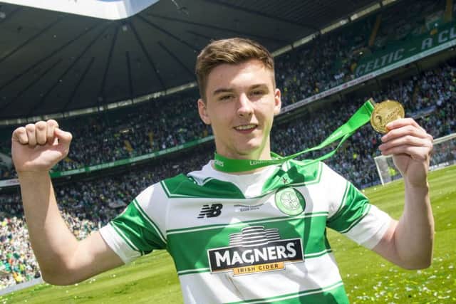 Celtic's Kieran Tierney with his Premiership winner's medal. Picture: Bill Murray/SNS