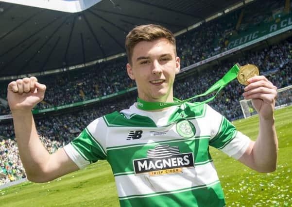 Celtic's Kieran Tierney with his Premiership winner's medal. Picture: Bill Murray/SNS