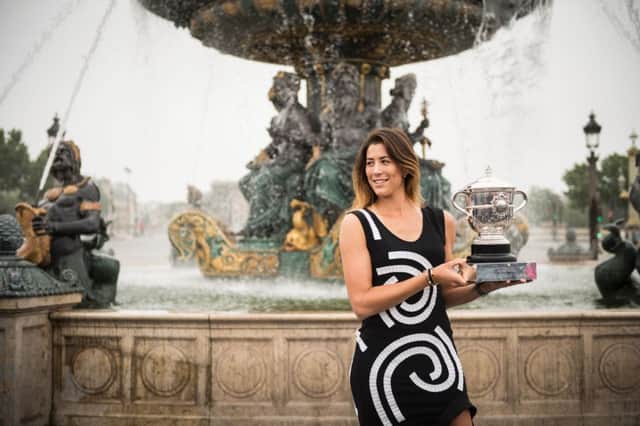 Garbine Muguruza  poses with the trophy at Place de la Concorde in Paris after her surprise French Open final win over Serena Williams this month.
 Picture: Martin Bureau/Getty