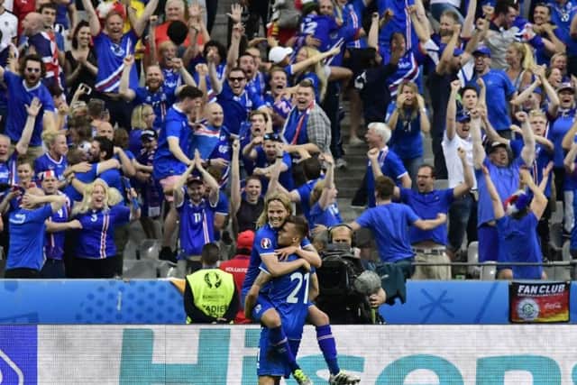 Icelands midfielder Arnor Ingvi Traustason celebrates his famous winning goal against Austria with team-mate Birkir Bjarnason. 
Picture: AFP/Getty Images