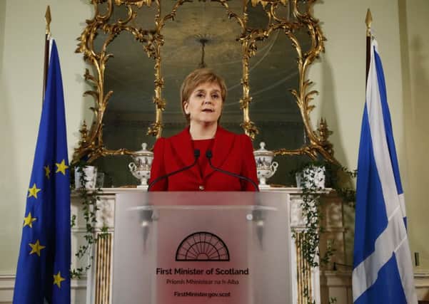 Nicola Sturgeon announced plans for a second independence referendum, flanked by the Scottish and EU flags. Picture: Scottish Government
