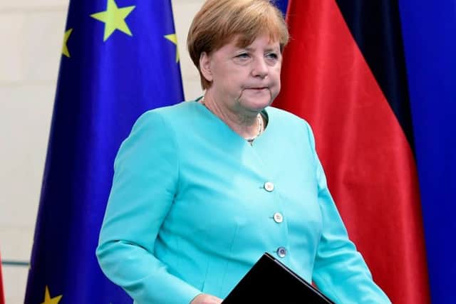 Angela Merkel, the German chancellor, before speaking to journalists. Picture: Getty