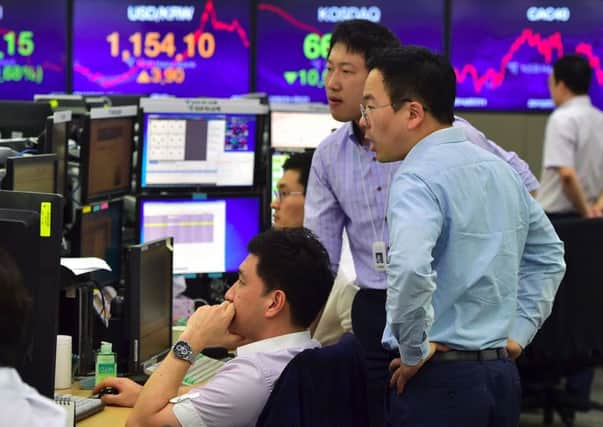 Currency dealers monitor rates in South Korea after the vote. Picture: Getty