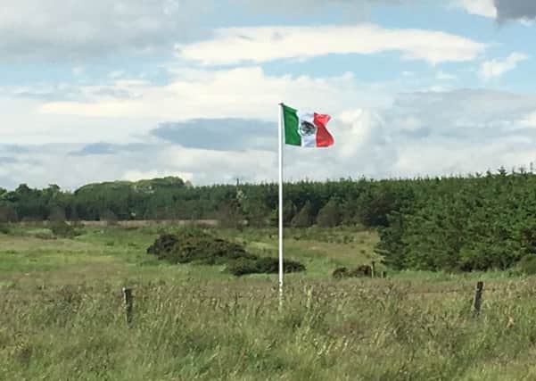 Michael Forbes whose land borders Donald Trump's controversial Aberdeenshire golf course is flying the Mexican flag in protest at the would-be president's opinions. Picture: Hemedia
