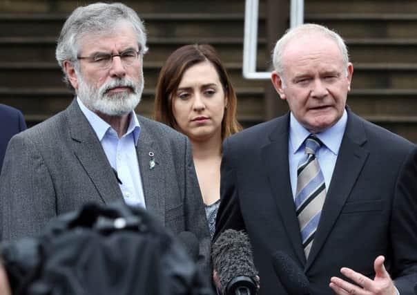 Sinn Fein leader Gerry Adams with Northern Irelands Deputy First Minister Martin McGuinness. Picture: Getty