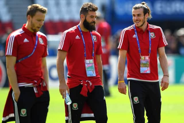 Wales players Joe Ledley, centre, Gareth Bale, right, and Chris Gunter share a joke at training. Picture: Stu Forster/Getty Images