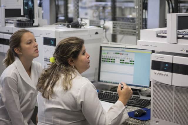 Lab technicians work at the Brazilian Doping Control Laboratory in Rio de Janeiro. Picture: Felipe Dana/AP