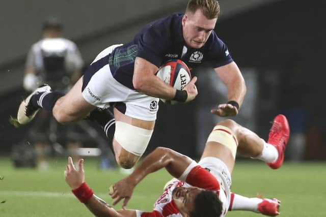 Scotland's Stuart Hogg is tackled by Japan's Hendrik Tui during the tourists' 21-16 win in Tokyo. Picture: Koji Sasahara/AP