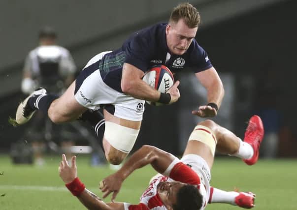 Scotland's Stuart Hogg is tackled by Japan's Hendrik Tui during the tourists' 21-16 win in Tokyo. Picture: Koji Sasahara/AP