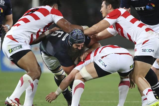 Scotland's Josh Strauss tries to find a way through the Japan defence. Picture: Koji Sasahara/AP