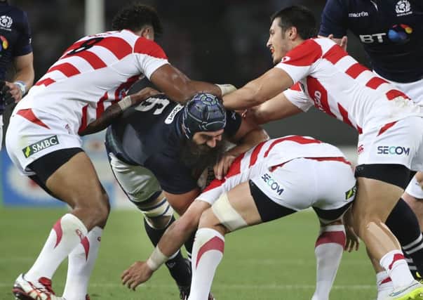 Scotland's Josh Strauss tries to find a way through the Japan defence. Picture: Koji Sasahara/AP