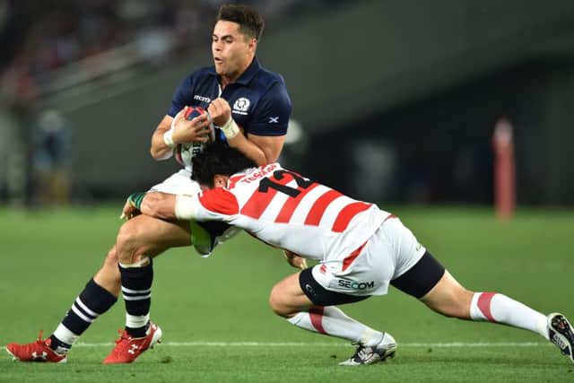 Scotland's wing Sean Maitland is tackled by Japan's centre Harumichi Tatekawa. Picture: Kazuhiro Nogikazuhiro/Getty
