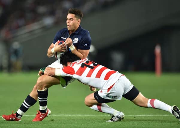 Scotland's wing Sean Maitland is tackled by Japan's centre Harumichi Tatekawa. Picture: Kazuhiro Nogikazuhiro/Getty