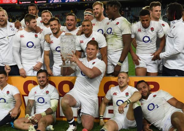 England's captain Dylan Hartley celebrates with the Cook Cup following the third Test win over Australia in Sydney. Picture: Saeed Khan/AFP/Getty Images