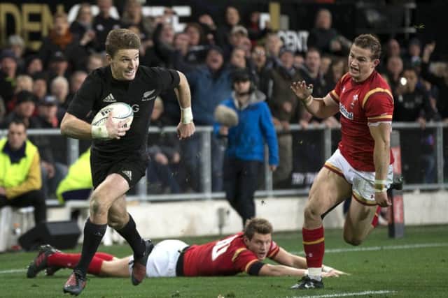 New Zealand's Beauden Barrett runs in for his second try against Wales. Picture: Brett Phibbs/New Zealand Herald via AP
