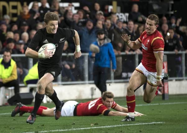 New Zealand's Beauden Barrett runs in for his second try against Wales.  Picture: Brett Phibbs/New Zealand Herald via AP