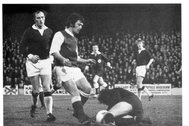 Kenny Garland thwarts Jimmy ORourke in Hibs famous 7-0 victory on 1 January 1973, the same day as Britain became a member of the European Economic Community.