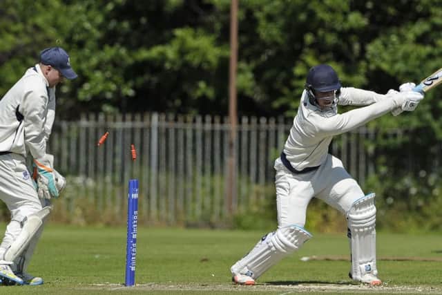 Tom Dryden of Heriot's is bowled but the Edinburgh club beat Falkland. Picture: Neil Hanna