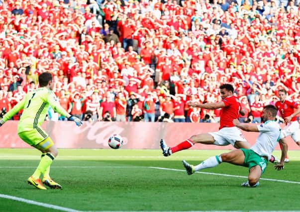 Northern Ireland's Gareth McAuley pokes the ball beyond his own goalkeeper to hand Wales victory. Photograph: Clive Rose/Getty Images