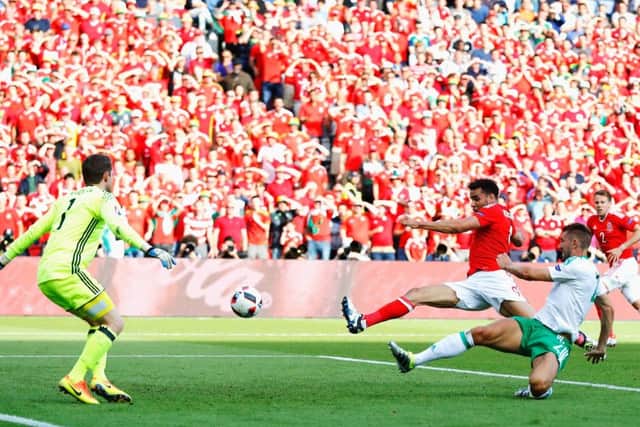 Northern Ireland's Gareth McAuley pokes the ball beyond his own goalkeeper to hand Wales victory. Photograph: Clive Rose/Getty Images