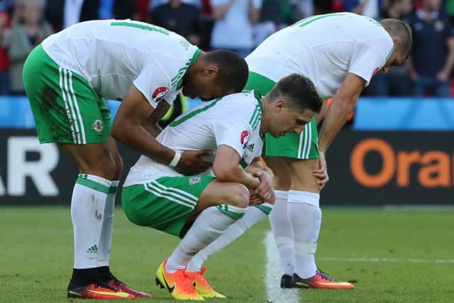 Northern Ireland players are a picture of dejection after their 1-0 defeat by Wales at Parc des Princes Stadium, Paris, on Saturday. Picture: Getty