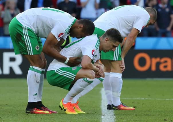 Northern Ireland players are a picture of dejection after their 1-0 defeat by Wales at Parc des Princes Stadium, Paris, on Saturday. Picture: Getty