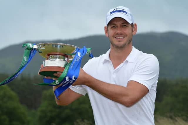 James Heath holds the trophy after winning the SSE Scottish Hydro Challenge with a record-breaking 21-under-par aggregate. Picture: Getty