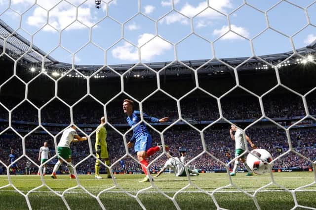 Antoine Griezmann celebrates after sidefooting his second goal past Republic of Ireland keeper Darren Randolph. Picture: AFP/Getty