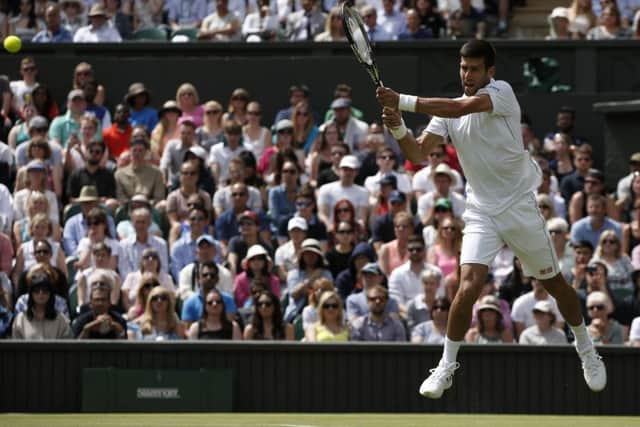 Novak Djokovic  on his way to winning the first set 6-0 against James Ward. Picture: Adrian Dennis/AFP