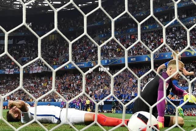 Ragnar Sigurdsson  turns away in celebration after equalising against England. Picture:  Paul Ellis/Getty Images