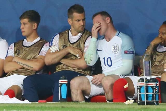 Wayne Rooney shows his frustration on the bench after being replaced during the match between England and Iceland. Picture: Getty Images