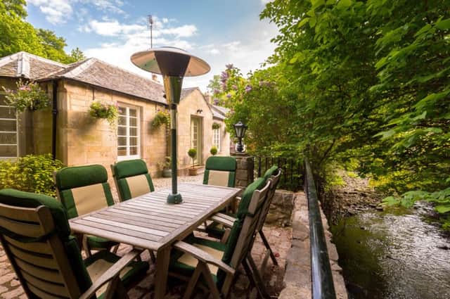 Burnside Cottage, sits by Burdiehouse Burn