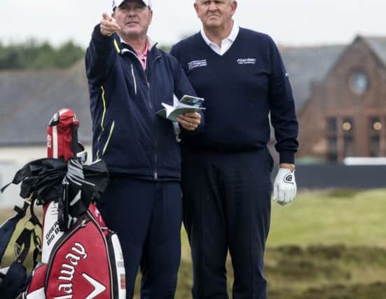 IRVINE, SCOTLAND - JUNE 28: Caddy Alastair McLean points to the 15th green with Colin Montgomerie at Gailes Links Golf Course on June 28, 2016 in Irvine, Scotland. (Photo by Christian Cooksey/R&A/R&A via Getty Images)