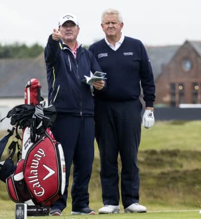 IRVINE, SCOTLAND - JUNE 28: Caddy Alastair McLean points to the 15th green with Colin Montgomerie at Gailes Links Golf Course on June 28, 2016 in Irvine, Scotland. (Photo by Christian Cooksey/R&A/R&A via Getty Images)