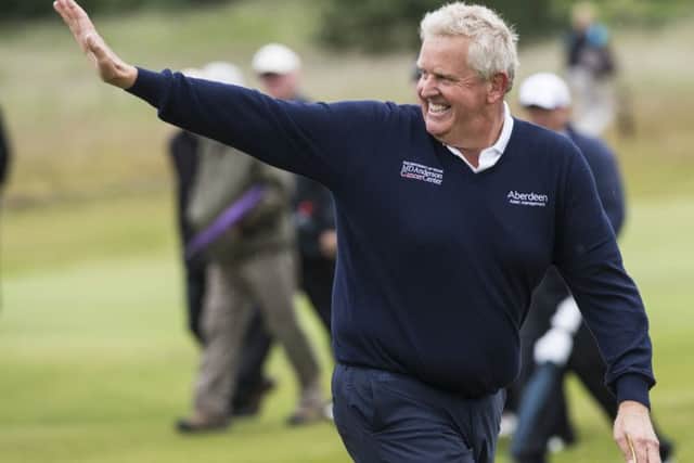 Colin Montgomerie thanks the crowd after finishing his first round at Gailes Links. Picture: Christian Cooksey/R&A/R&A via Getty Images