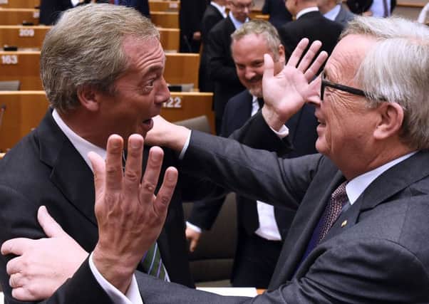 UKIP leader Nigel Farage reacts as he meets EU Commission President Jean Claude Juncker. Picture: AFP/Getty Images