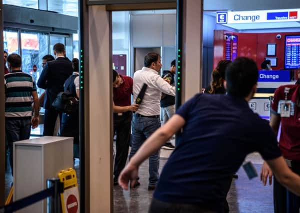 Security personnel at  the international arrivals terminal at Istanbuls Ataturk airport, where two of the three terrorists detonated their bombs. Picture: Getty
