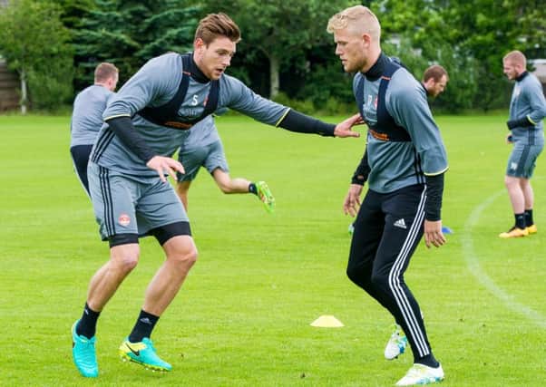 Ash Taylor, left, and new signing Jayden Stockley train ahead of Aberdeens clash with Fola Esch. Picture: SNS