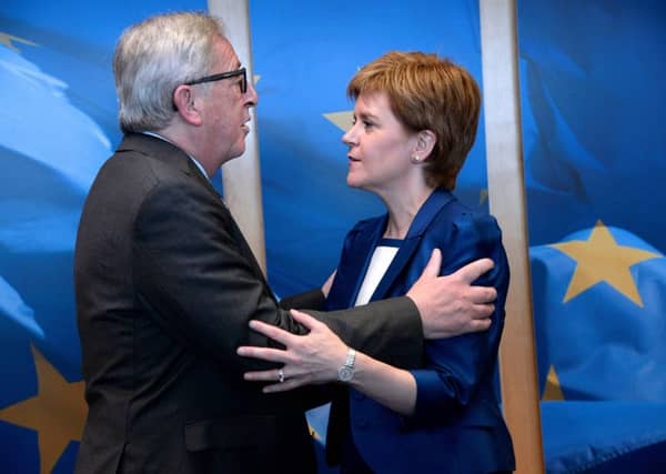 European Parliament President Martin Schulz, main, walks with Nicola Sturgeon at the European Parliament in Brussels. Picture: Getty