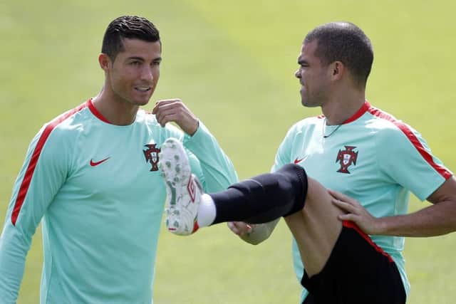 Portugal pair Cristiano Ronaldo, left, and Pepe in training ahead of tonight's quarter-final against Poland. Picture: AP/Michael Sohn