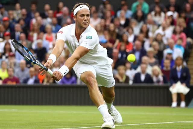 Marcus Willis plays a forehand during his second round match against Roger Federer on Centre Court. Picture: Julian Finney/Getty