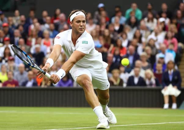 Marcus Willis plays a forehand during his second round match against Roger Federer on Centre Court. Picture: Julian Finney/Getty