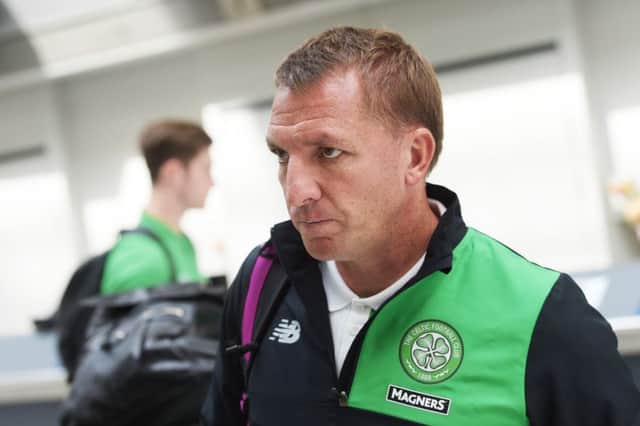 Celtic manager Brendan Rodgers arrives at Glasgow Airport as his side prepare to fly out to Slovenia. Picture: SNS