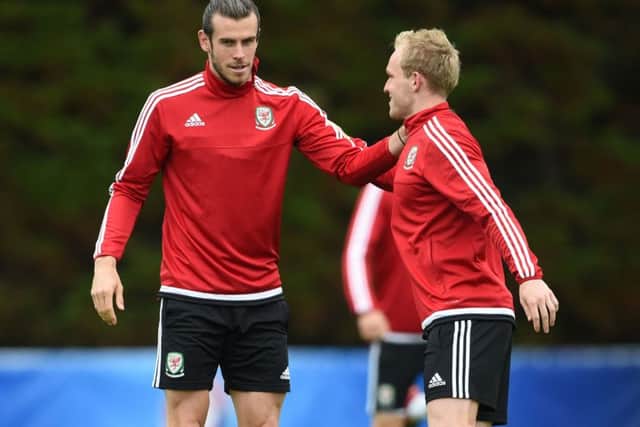 Gareth Bale, left, and Jonathan Williams during a training session in Dinard yesterday. Picture: Joe Giddens/PA