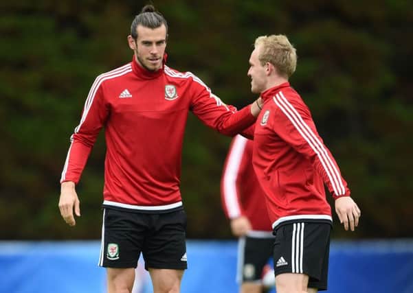Gareth Bale, left, and Jonathan Williams during a training session in Dinard yesterday. Picture: Joe Giddens/PA